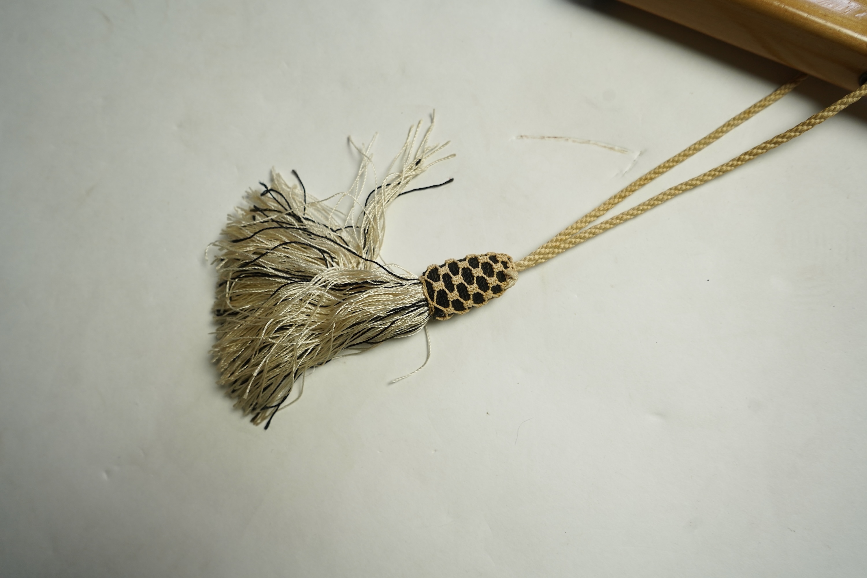 An unusual early 20th century cream silk and black velvet parasol and silk corded tassel. 64cm high. Condition - good